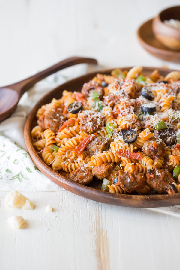 Supreme Pizza Pasta topped with parmesan cheese.  