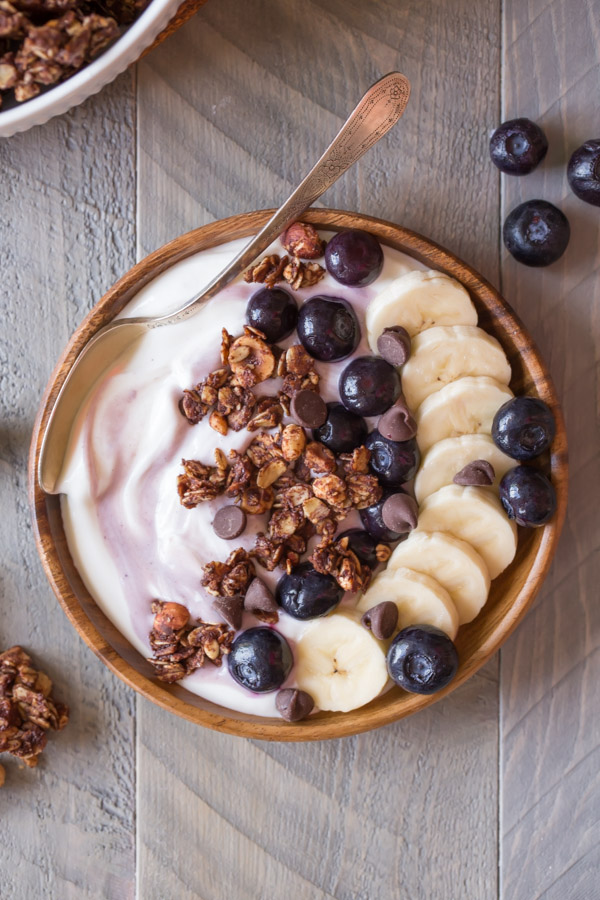 Chocolate Hazelnut Granola Yogurt Bowl - Creamy yogurt topped with blueberries, bananas and homemade Chocolate Hazelnut Granola.