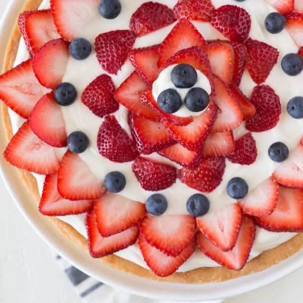 Strawberry Cream Cheese Tart - A buttery shortbread crust topped with a sweetened cream cheese filling and fresh berries. Easy, delicious, and patriotic!