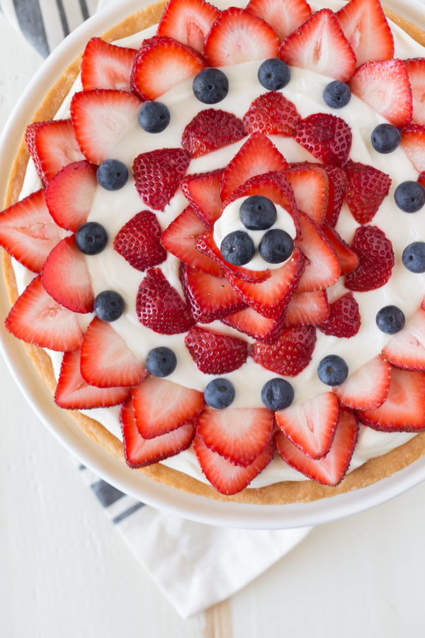 Strawberry Cream Cheese Tart - A buttery shortbread crust topped with a sweetened cream cheese filling and fresh berries. Easy, delicious, and patriotic!