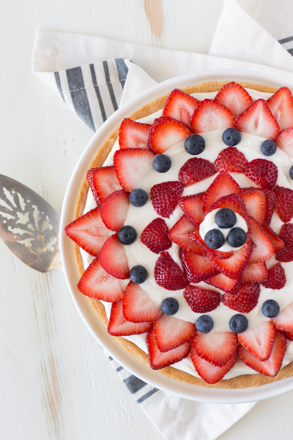 Strawberry Cream Cheese Tart on a cake stand.  