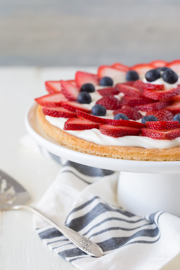 Strawberry Cream Cheese Tart on a cake stand.  