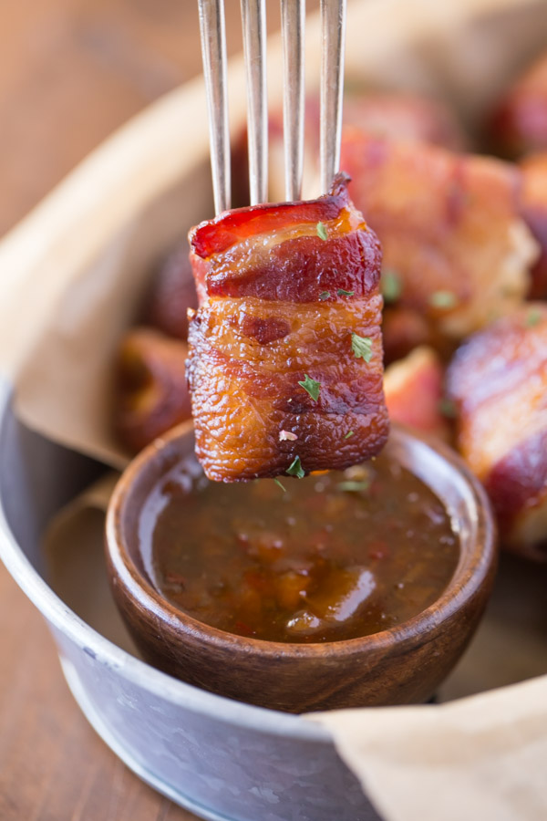 Bacon Wrapped Chicken Bites With Apricot Pepper Dipping Sauce - the perfect combination of sweet and spicy. You might want to double the recipe because they are gone in a flash!