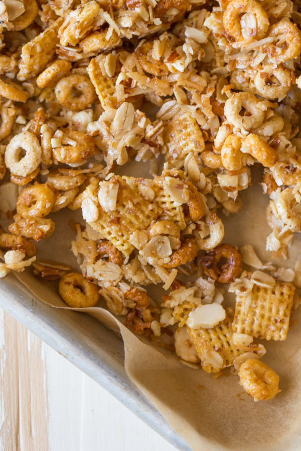 Healthier Coconut Almond Chex Mix - The perfect sweet and salty combo made healthier with coconut oil, honey, oats and almonds!