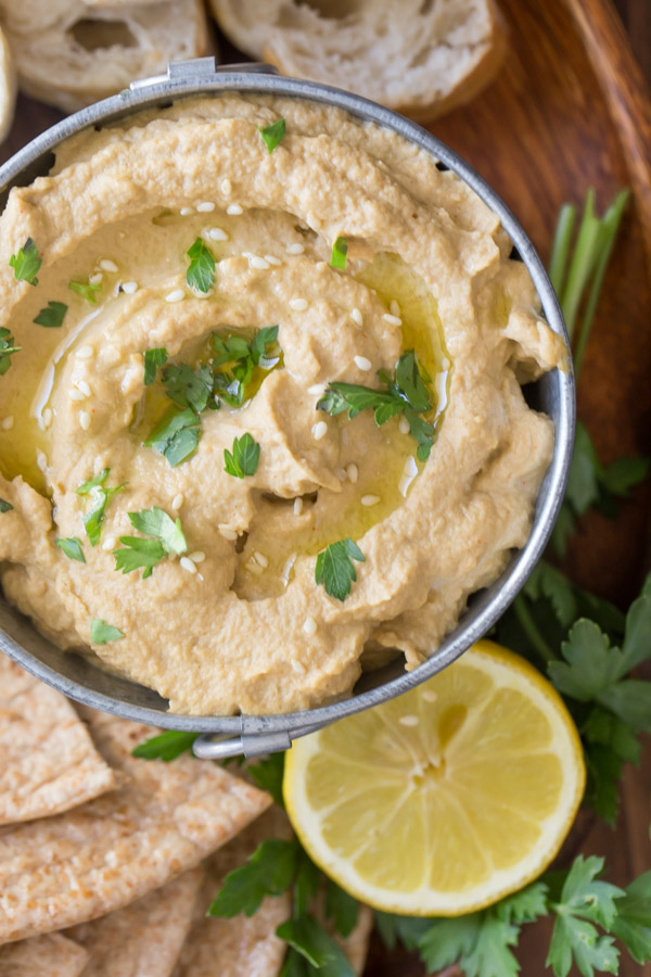 Roasted Eggplant Dip drizzled with olive oil and sprinkled with parsley and toasted sesame seeds.