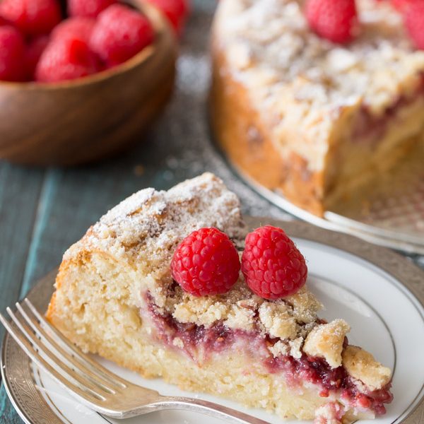 Raspberry Almond Coffee Cake - Layers of moist almond cake, sweetened cream cheese, raspberry preserves and an almond streusel topping.