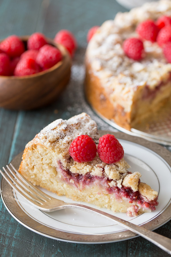 Raspberry Almond Coffee Cake - Layers of moist almond cake, sweetened cream cheese, raspberry preserves and an almond streusel topping.