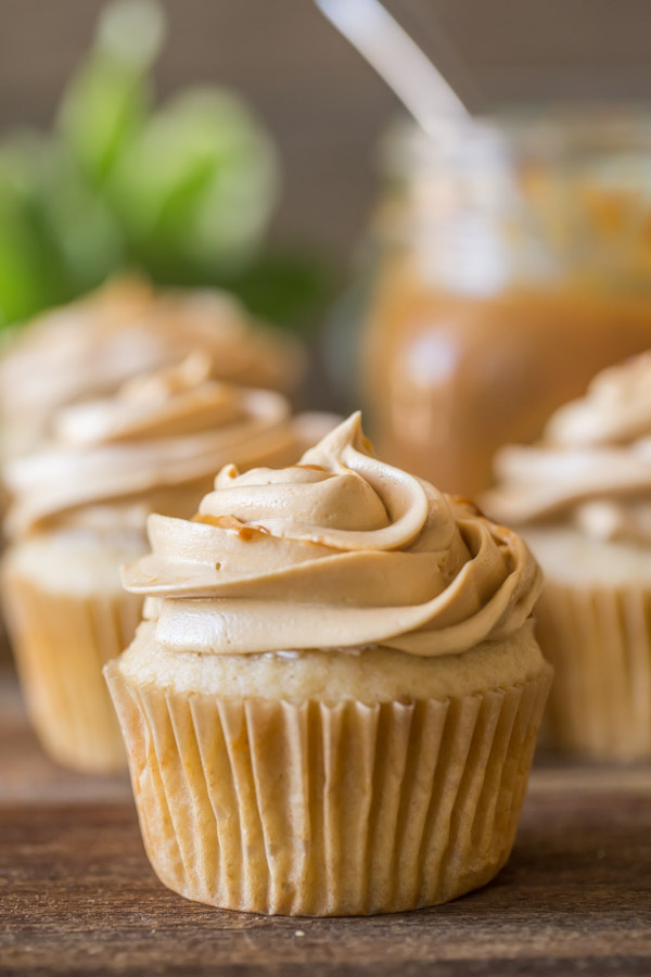 Apple Cupcakes With Dulce De Leche Buttercream - Sweet and tart apple cupcakes are topped with a buttercream and dulce de leche swirl! Match made in heaven!
