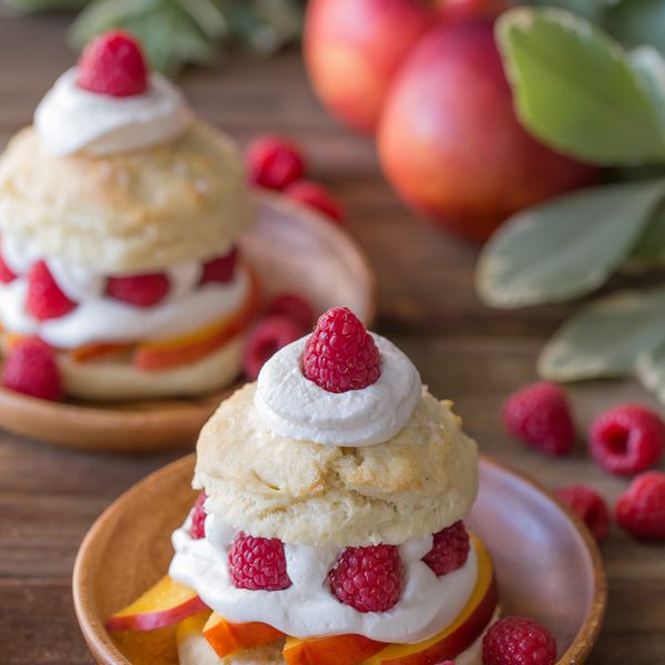 Raspberry Peach Shortcakes - My favorite sweet, buttery, flakey biscuits filled with juicy, ripe peaches, fresh raspberries, and homemade whipped cream.