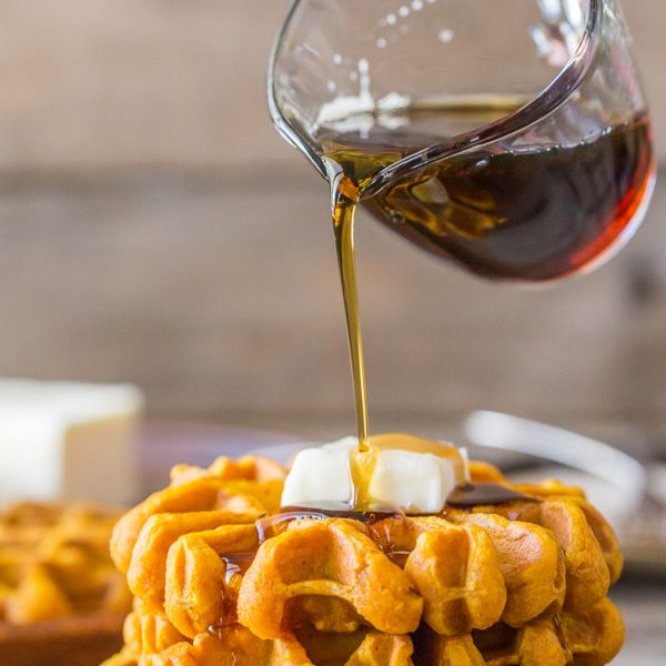 Pumpkin Spice Waffles - Made with pure pumpkin puree and coconut oil, these waffles are moist, fluffy and ready for maple syrup!
