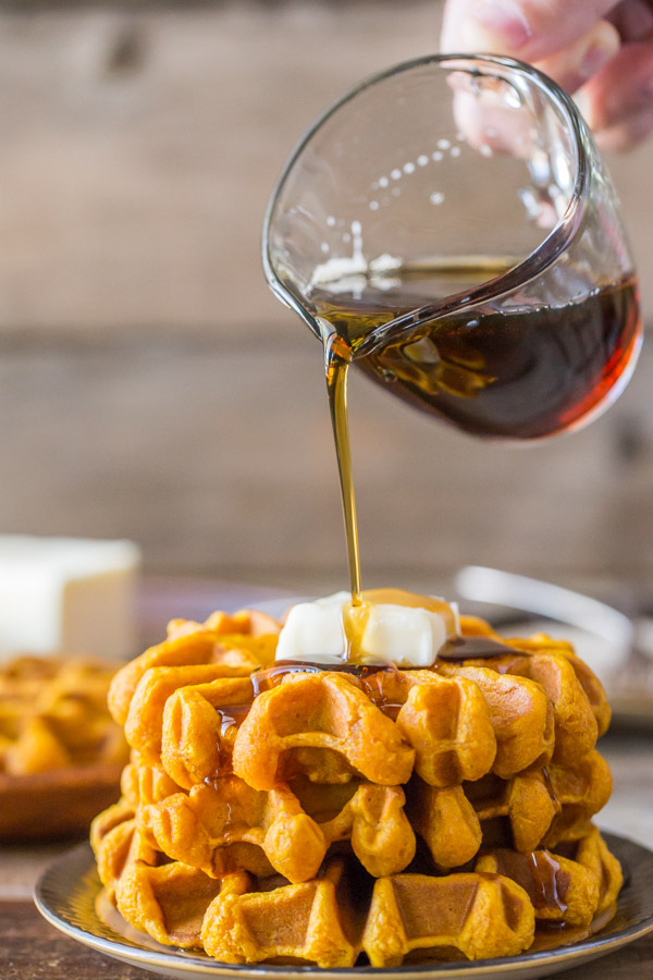 Pumpkin Spice Waffles - Made with pure pumpkin puree and coconut oil, these waffles are moist, fluffy and ready for maple syrup!