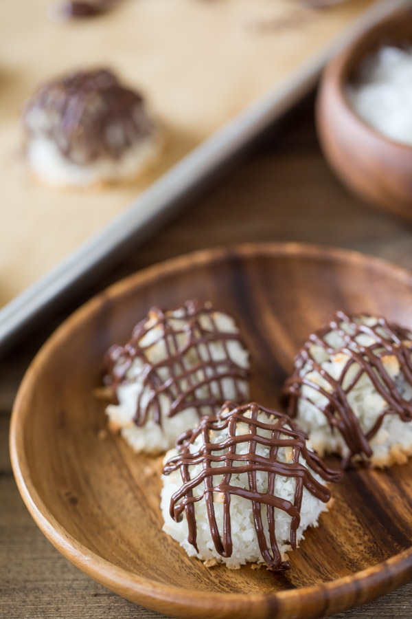 Stuffed Chocolate Almond Macaroons - Coconut macaroons flavored with vanilla and almond, stuffed with a mini sized candy bar and drizzled with chocolate!