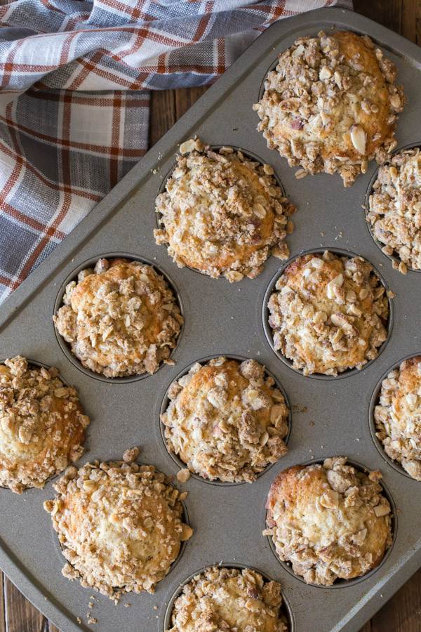 Banana Muffins With Almond Oat Streusel Topping in a muffin pan.