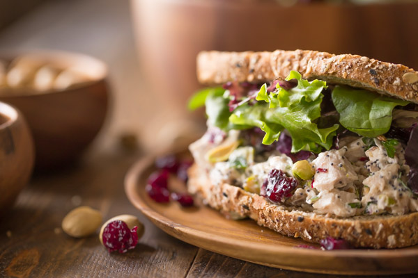 Cranberry Pistachio Chicken Salad Sandwich on a plate.  