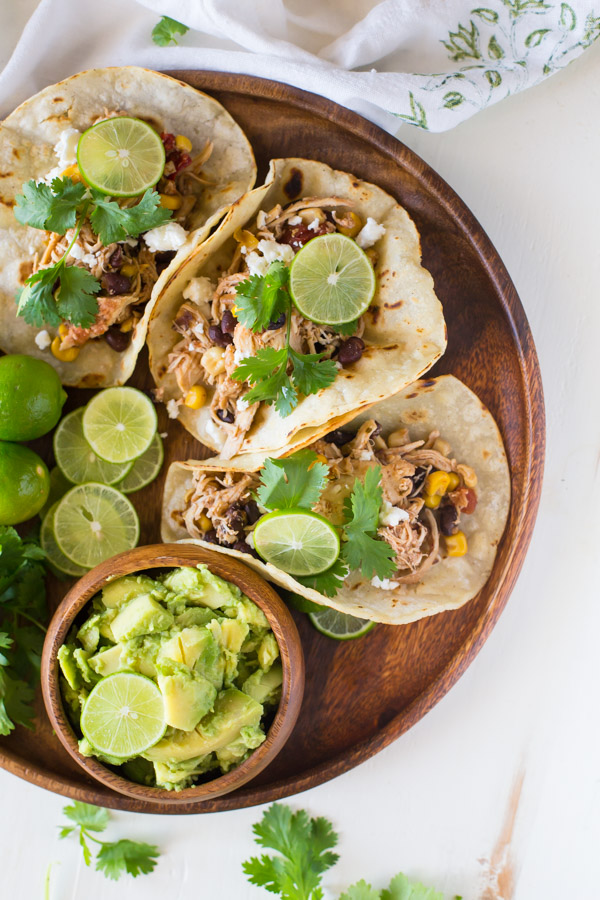 Crockpot Salsa Chicken Tacos - Easy, healthy, and everyone loves it! Game day crowd pleaser that almost makes itself!