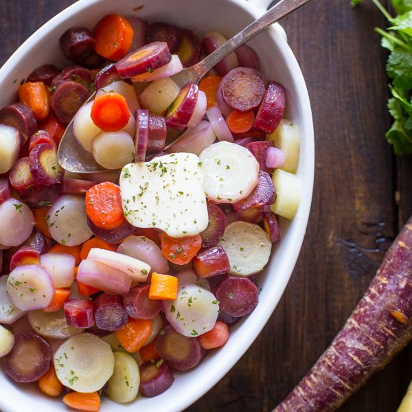 Honey Roasted Rainbow Carrots - A beautiful trio of purple, white, and orange carrots roasted to tender perfection and finished off with honey and butter.