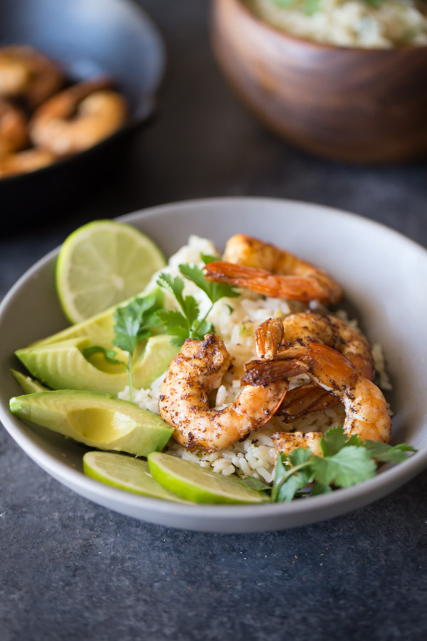 Cilantro Lime Rice Shrimp Bowl - Shrimp sautéd in a spiced butter served over a zesty cilantro lime rice. So easy and fresh!