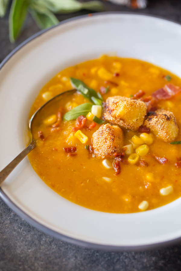 Butternut Squash Corn Chowder With Goat Cheese Croutons - A wonderfully balanced recipe with sweet corn, smokey bacon, chipotle peppers, and creamy goat cheese. Everyone will want to go back for more!