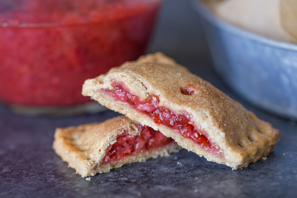 A Whole Wheat Strawberry Rhubarb Fruit Pocket cut in half. 