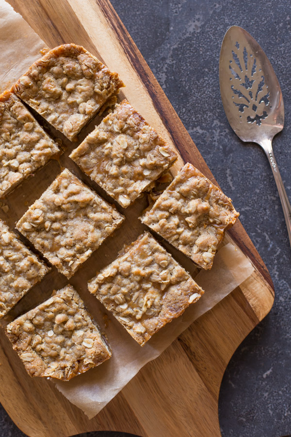 Carmelitas cut into squares on a cutting board.  