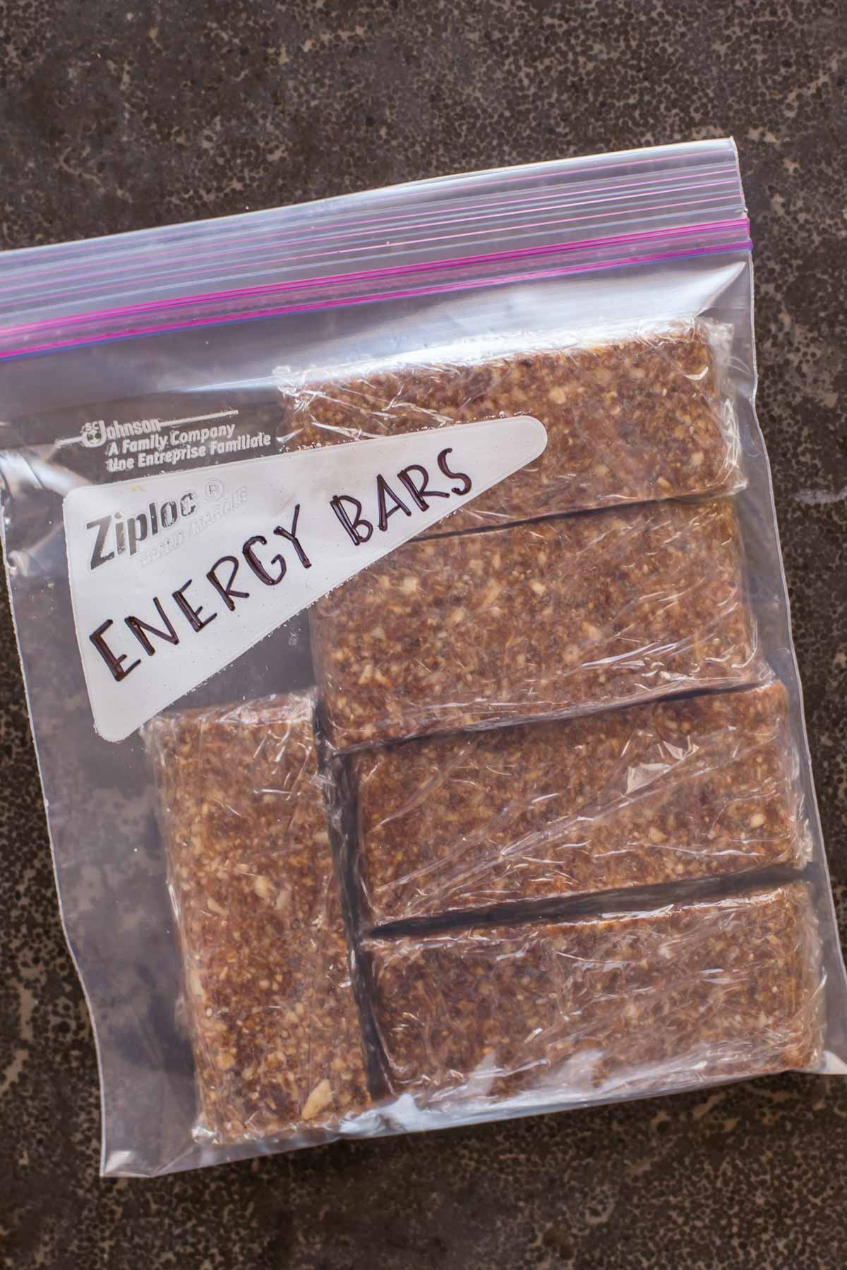 Five Ingredient No Bake Energy Bars individually wrapped in plastic, inside a Ziploc bag labeled Energy Bars.