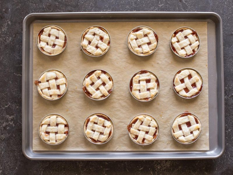 Buttery, flaky pie crust with strawberry jam for filling baked inside a mason jar lid!