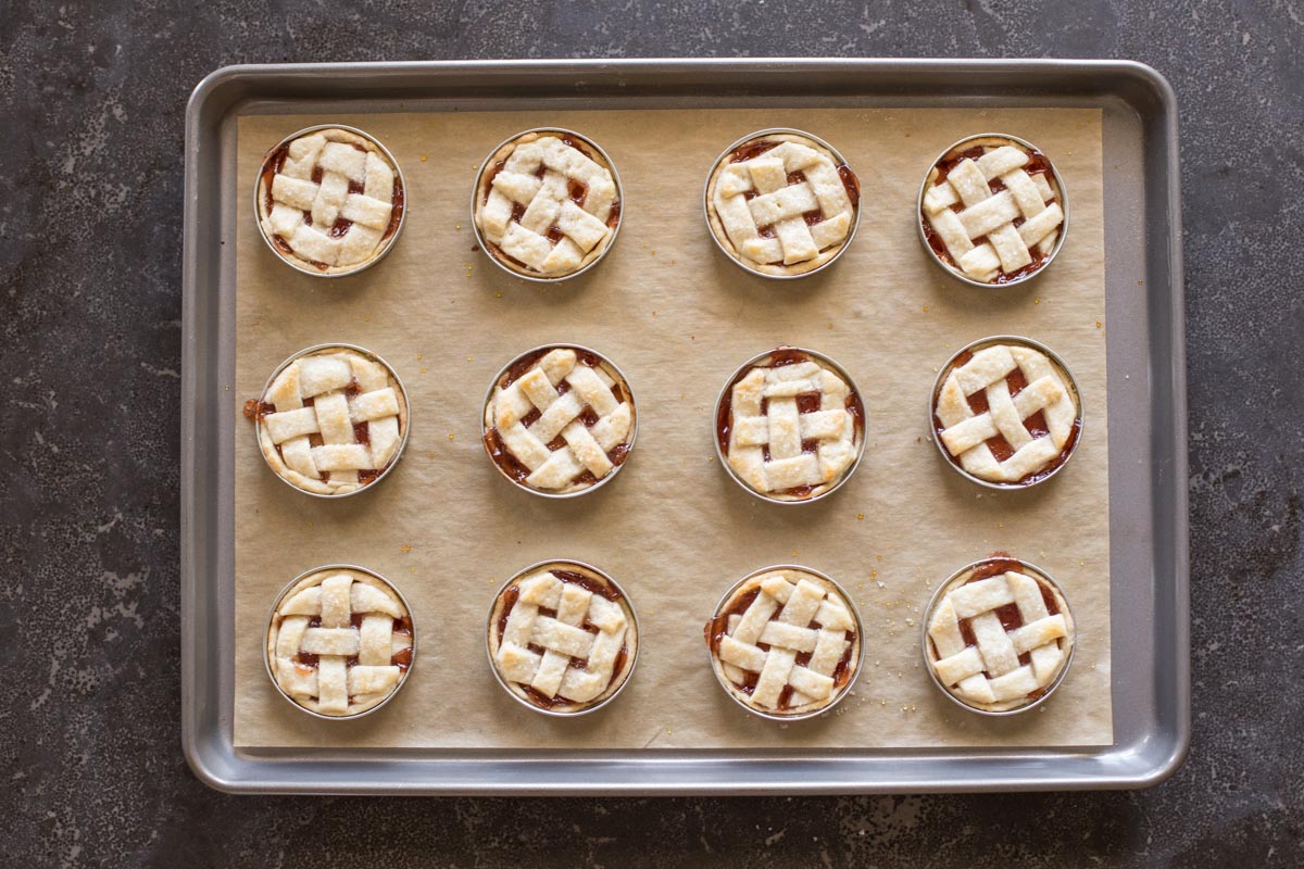Buttery, flaky pie crust with strawberry jam for filling baked inside a mason jar lid!