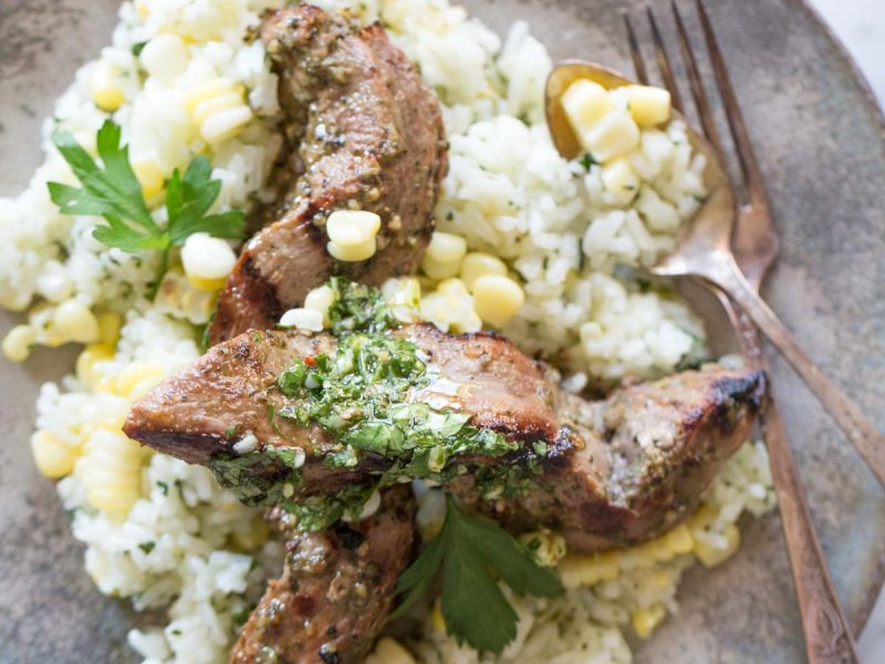 Celebrating all the bold flavors of Brazil with this recipe for marinated flank steak served over chimichurri rice!