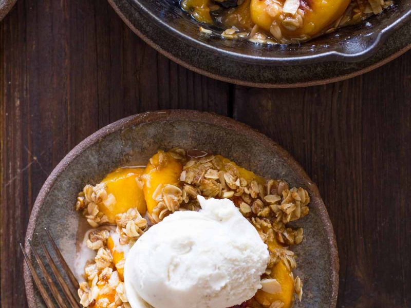 Just sweet, warm peaches with a blanket of crunchy, buttery oats and almonds. Easier than pie!