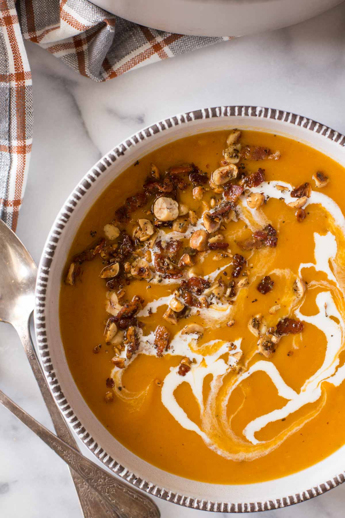Roasted butternut squash and sweet potatoes, onions, bacon, sage, toasted hazelnuts and a delicate drizzle of heavy cream. This soup is downright luxurious.