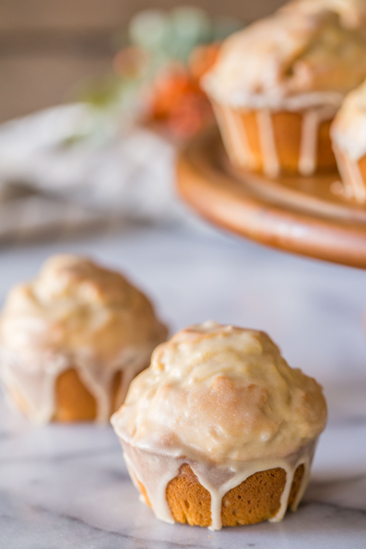 These Maple Glazed Donut Muffins are easy to make, fun to glaze, and have the texture of a cake donut!
