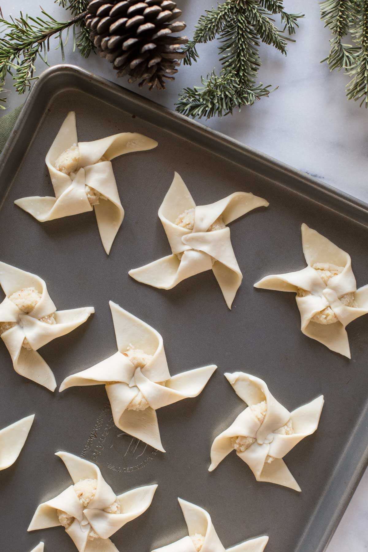 The perfect make ahead Christmas breakfast idea, using pre-made frozen puff pastry dough and a homemade almond filling. These Almond Pinwheels are heavenly!