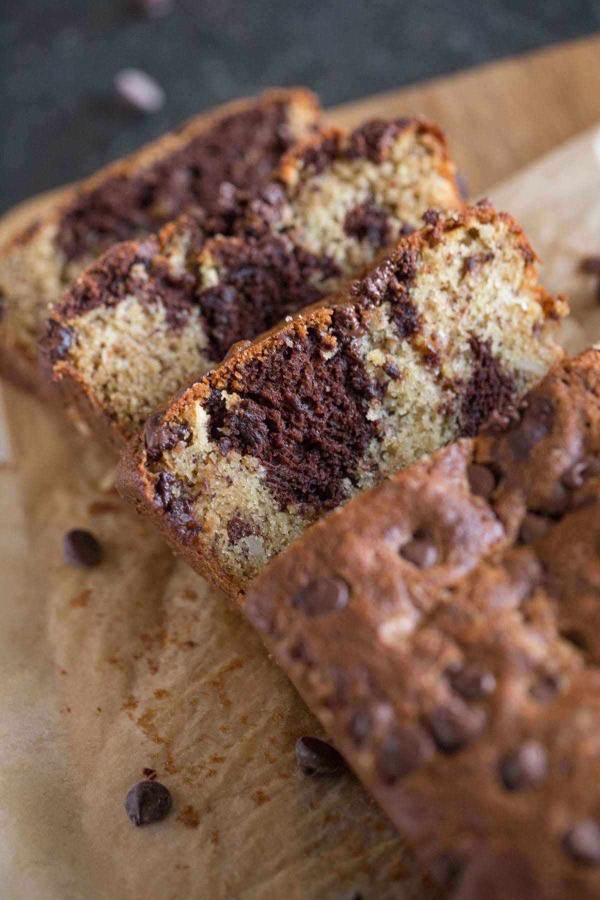 A loaf of Marbled Chocolate Banana Bread that has been sliced.  