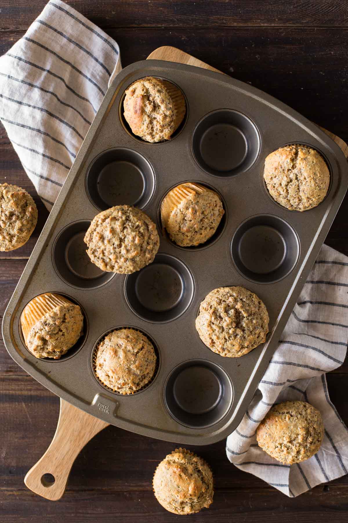 Honey Bran Muffins in, on and around a muffin pan.