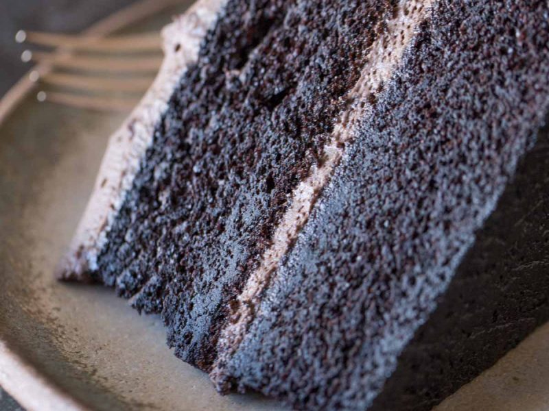 This super moist and decadent Dark Chocolate Cake With Whipped Cream Frosting made a cake lover out of me! Try it and you'll see!