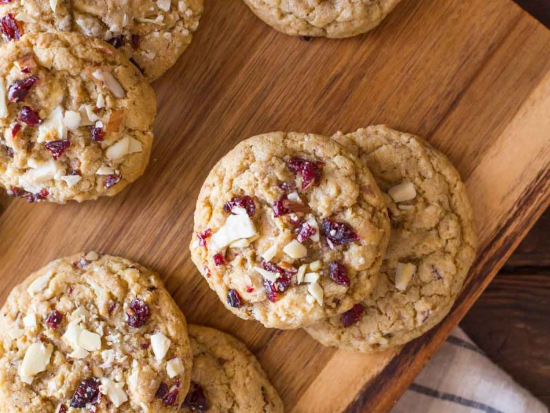 I ADORE these Cranberry Almond White Chocolate Chunk Cookies! They bake up thick and chewy, with a rich, sweet buttery flavor studded with tangy bits of cranberry!