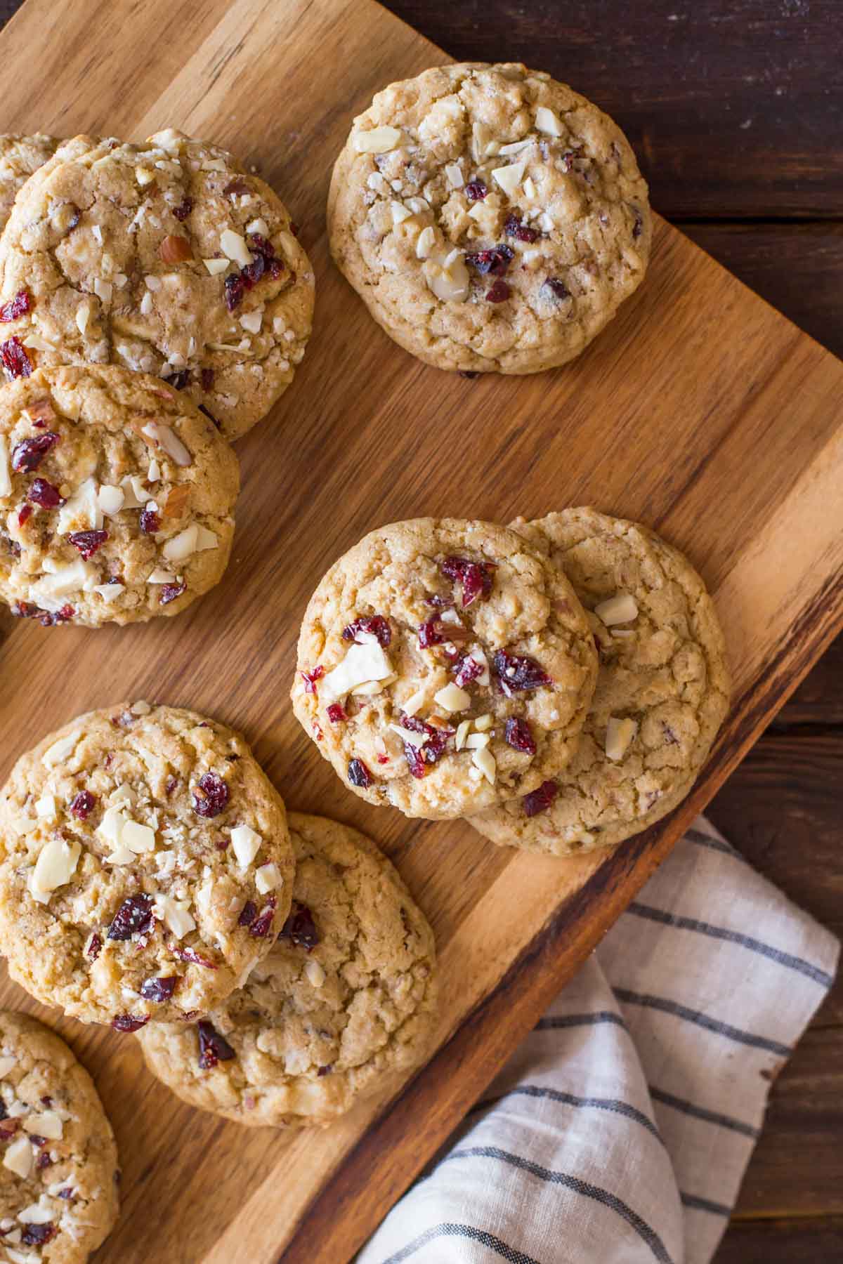 I ADORE these Cranberry Almond White Chocolate Chunk Cookies! They bake up thick and chewy, with a rich, sweet buttery flavor studded with tangy bits of cranberry!
