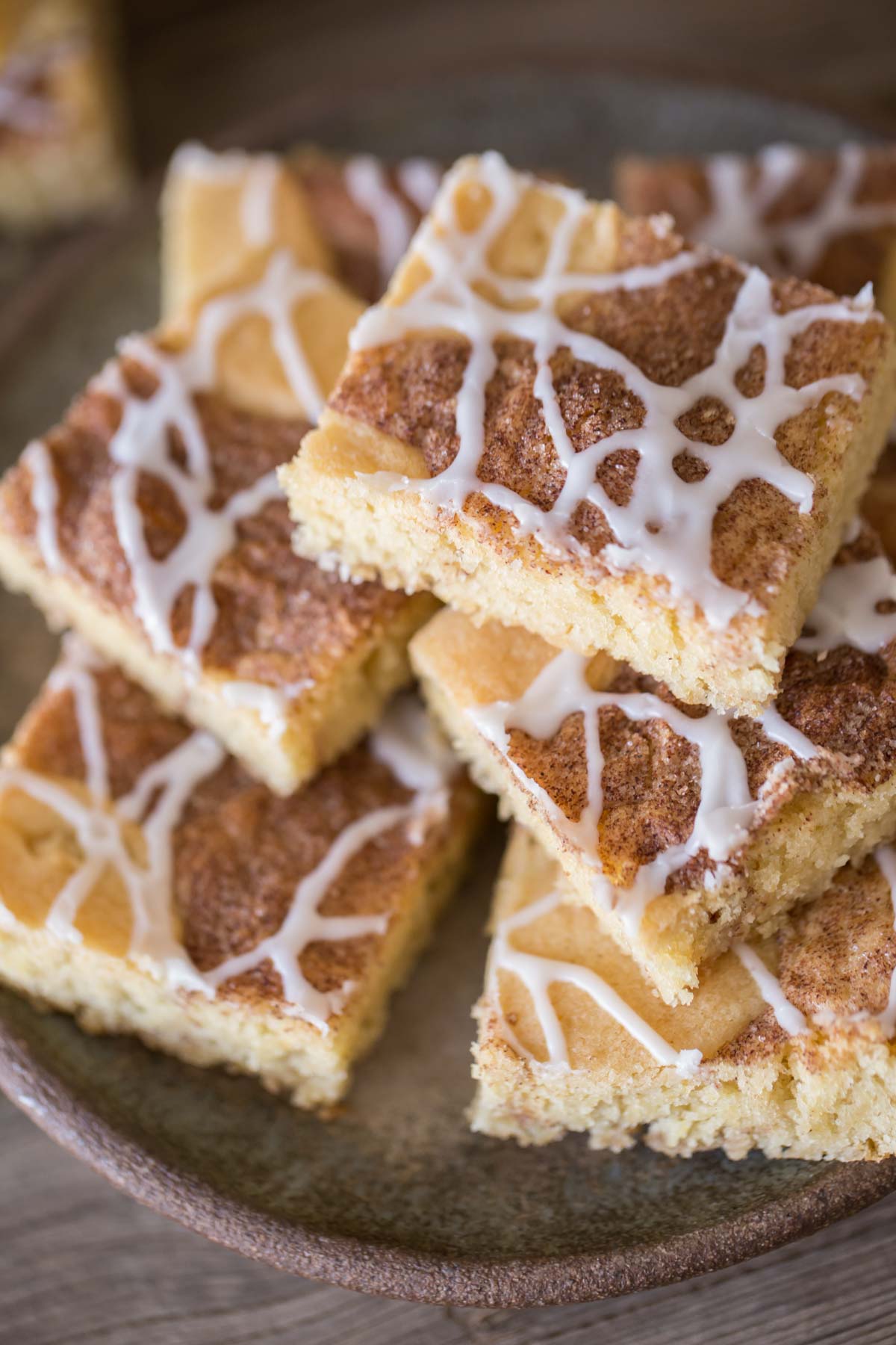 These Snickerdoodle Bars taste just like the classic cookies we all love, but come together much more quickly and are topped with a delicious vanilla glaze!