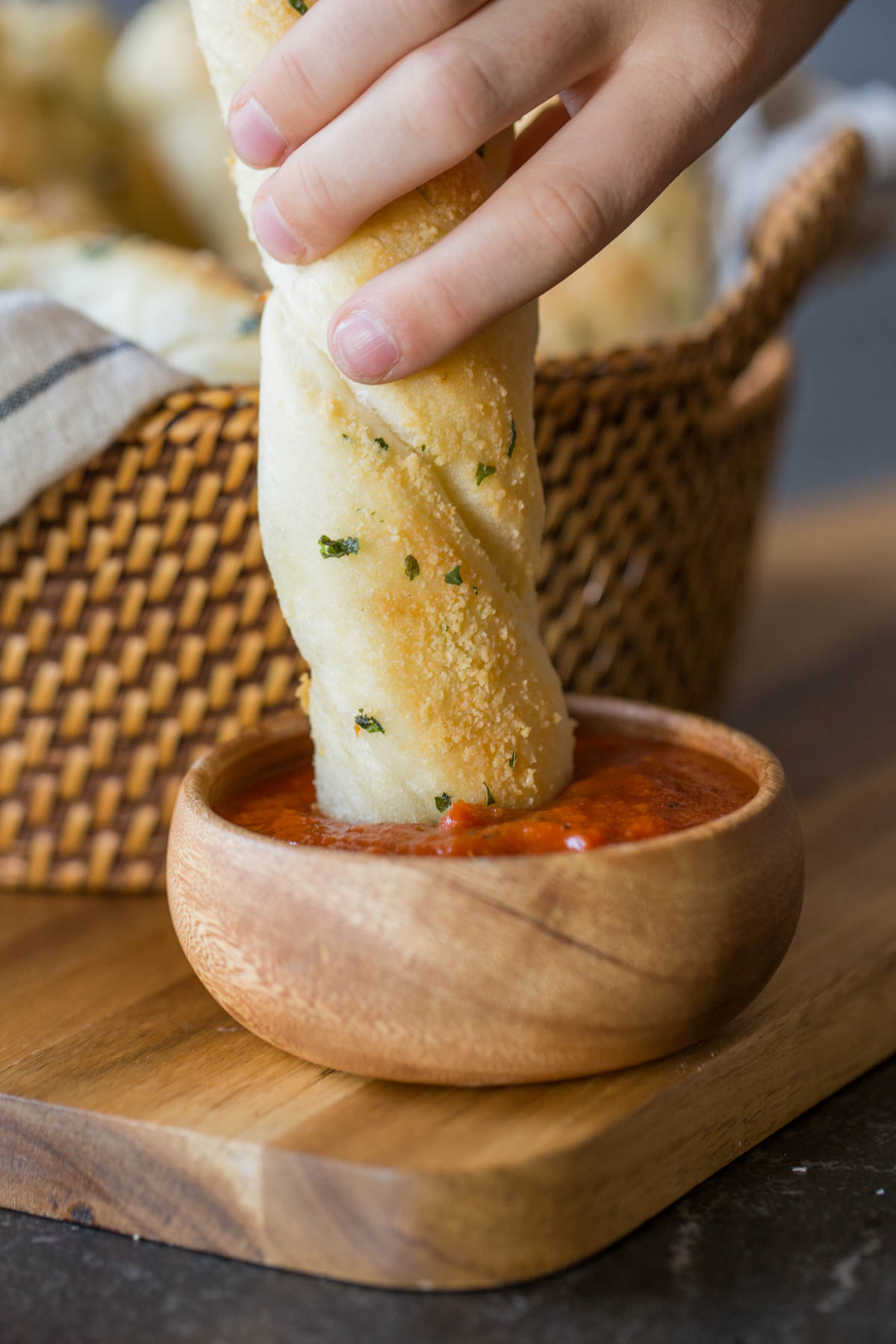 Fresh Buttery Garlic Breadsticks dipped in marinara.