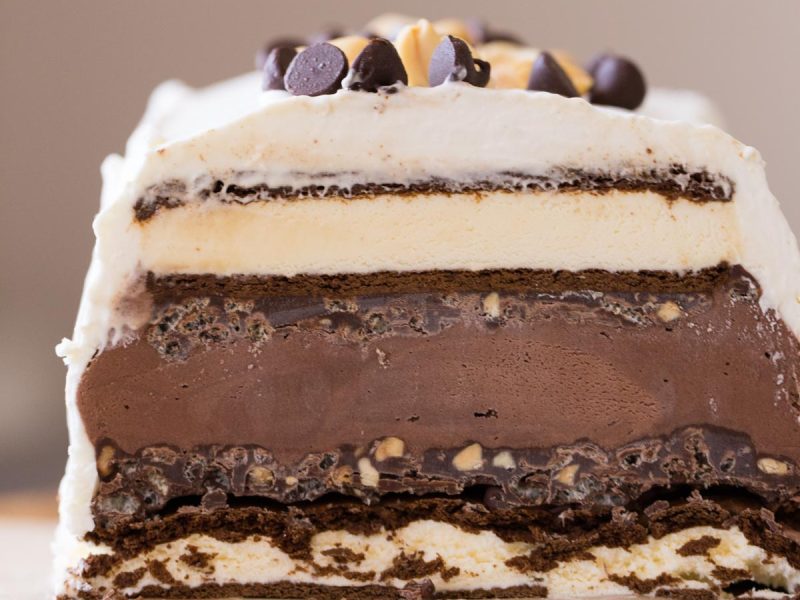This Chocolate Peanut Butter Ice Cream Slice Cake is so clever, made with ice cream sandwiches, crunchy peanut butter ganache, and chocolate ice cream!