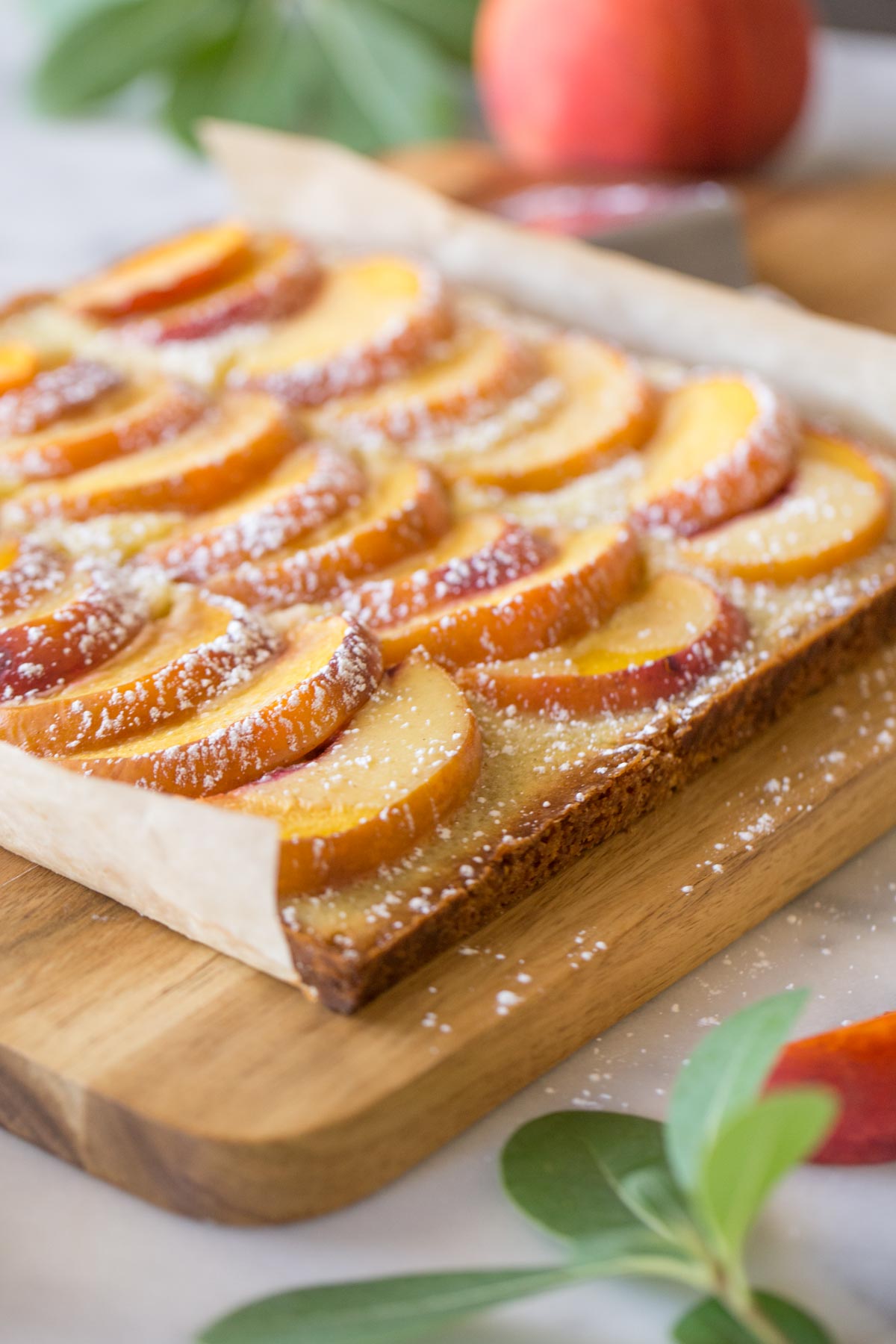 Peaches and Cream Shortbread Bars on a cutting board. 