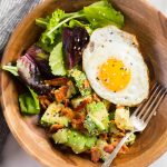 We've got creamy avocado and baby greens dressed with freshly squeezed lemon juice and sprinkled with crispy bacon and Everything But the Bagel Seasoning. Start your morning off right!