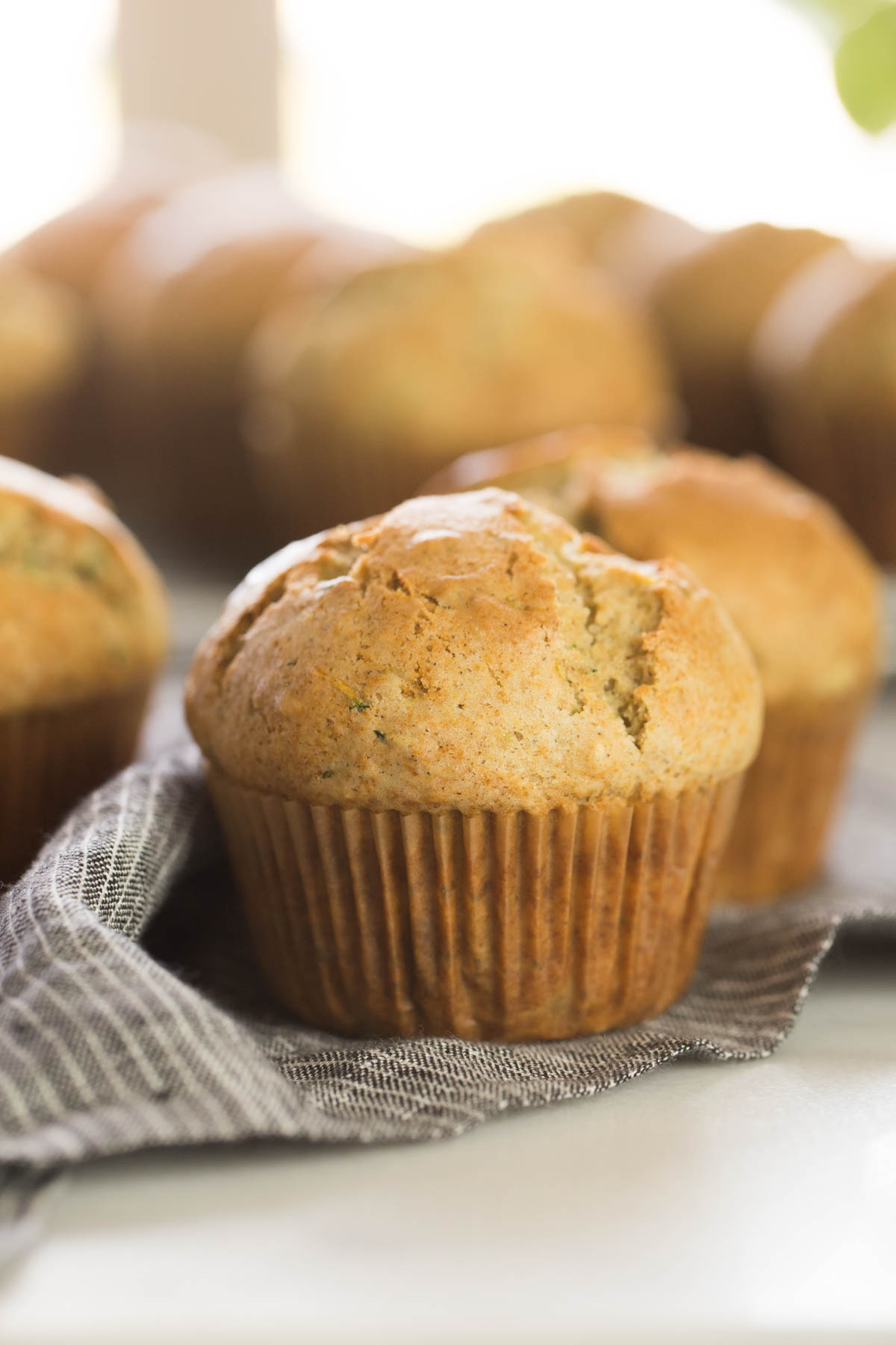 These Healthier Zucchini Muffins are just right with lots of grated zucchini, a little bit of spice, and just a touch of sweetness.  
