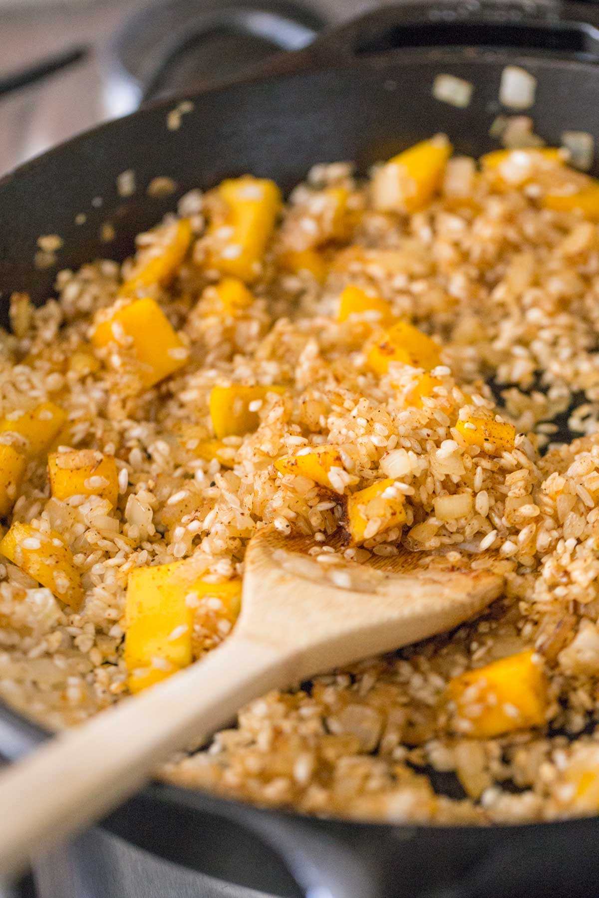 The rice mixture with the mangos in the skillet for the Chili Lime Mango Chicken and Rice. 