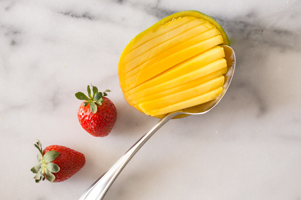 Mango sliced and scooped out of the peel.
