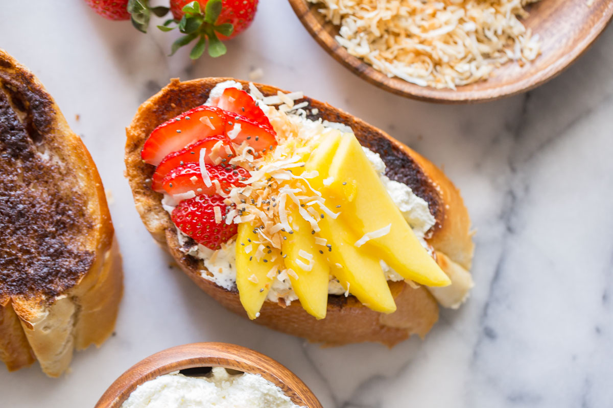 Top down view of Strawberry Mango Cinnamon Toast and ingredients.