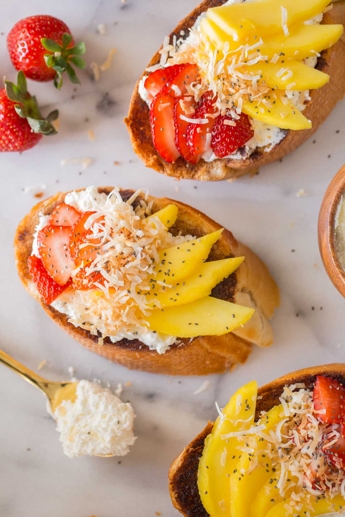 Top down view of Strawberry Mango Cinnamon Toast and ingredients.