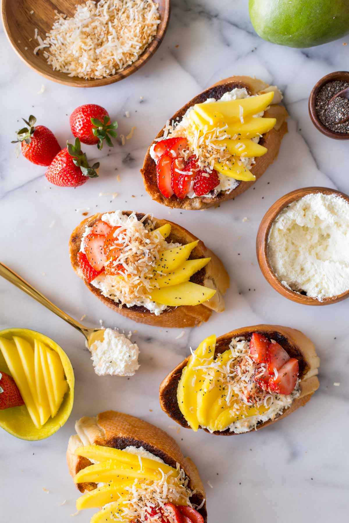 Top down view of Strawberry Mango Cinnamon Toast and ingredients.