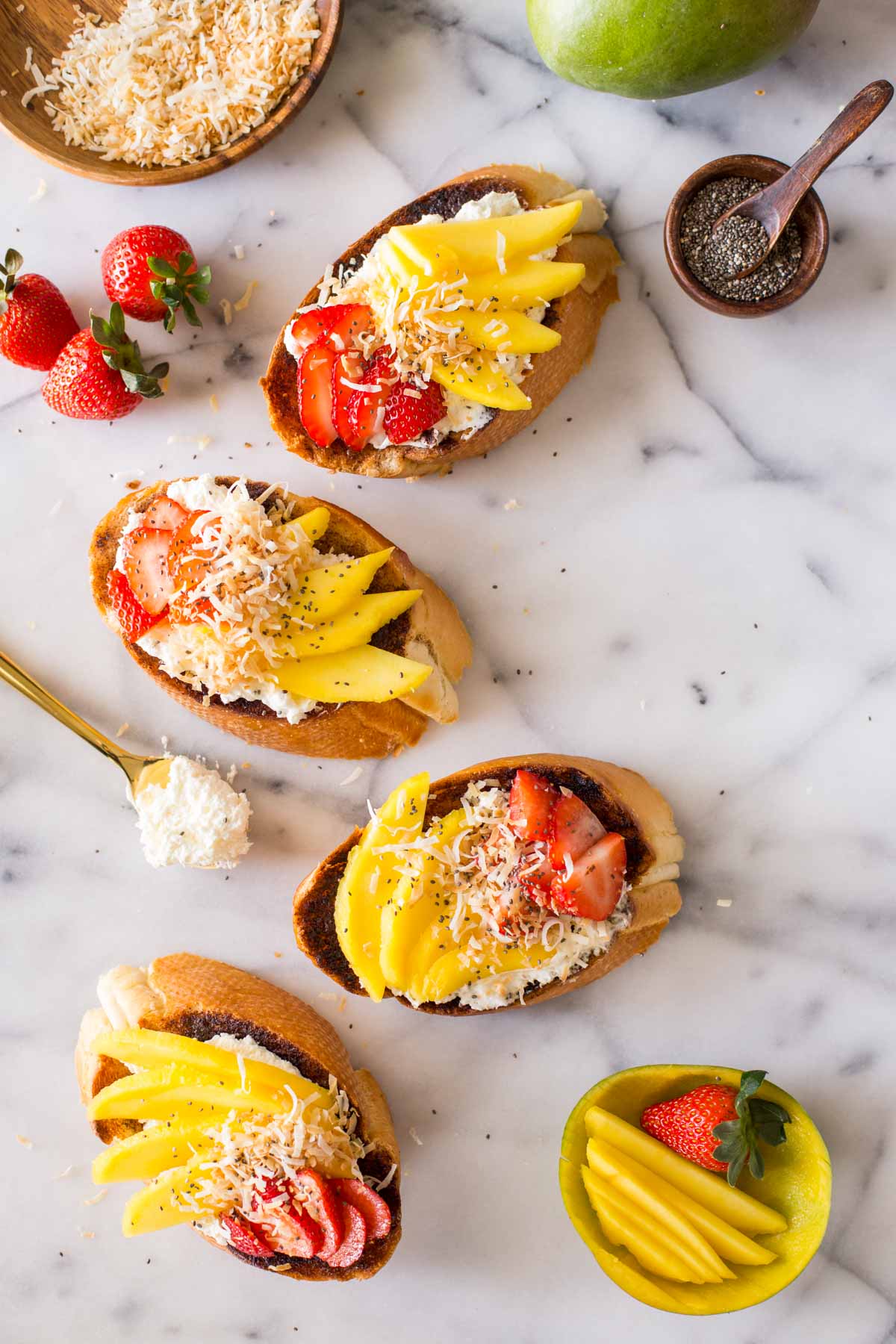 Top down view of Strawberry Mango Cinnamon Toast and ingredients.