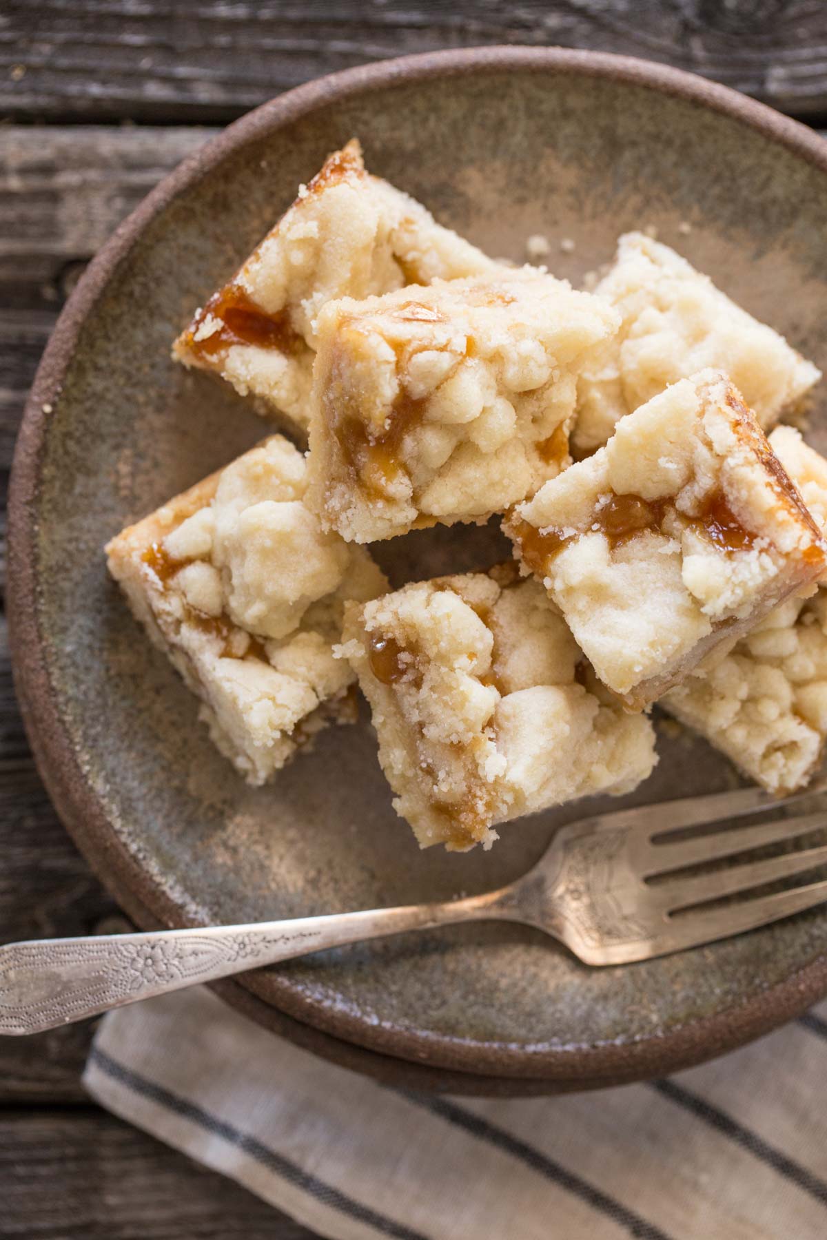 Close up overhead shot of Buttery Salted Caramel Bars on a green plate.